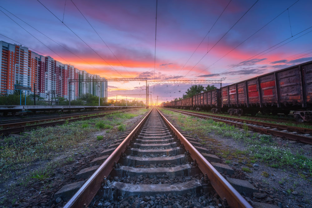 https://www.gragnani.it/wp-content/uploads/2021/07/railway-station-with-freight-trains-at-sunset-RLQCCUP.jpg
